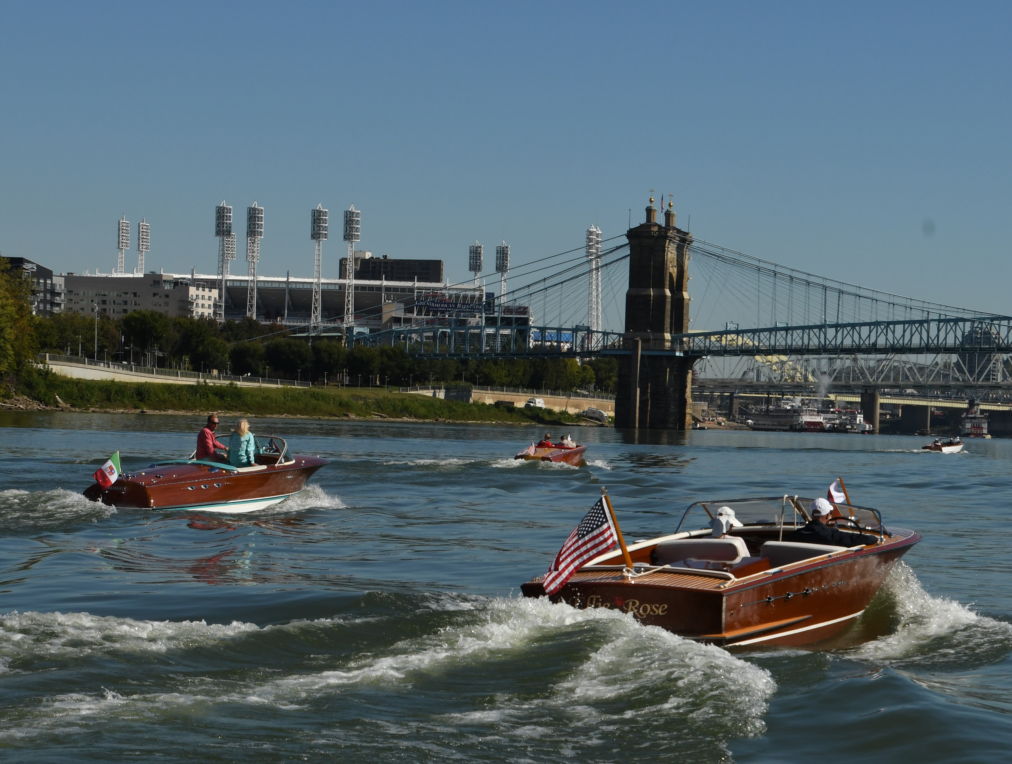 Three boats approaching the Roebling Suspension Bridge